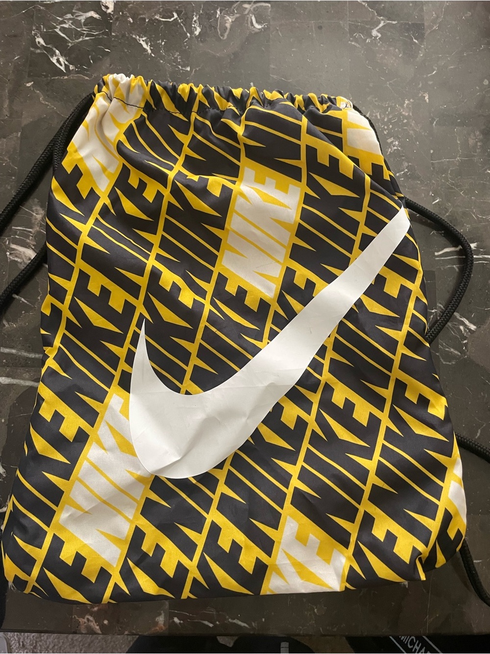 Nike Men’s Black, Yellow & White Repeating Logo Drawstring Bag